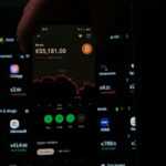 A person holding a cell phone in their hand