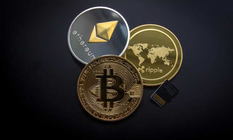 A striking image of Bitcoin, Ethereum, and Ripple coins illustrating modern digital currency.