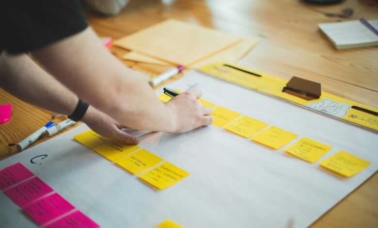 person writing on white paper