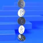 a group of three metal numbers sitting on top of a blue surface