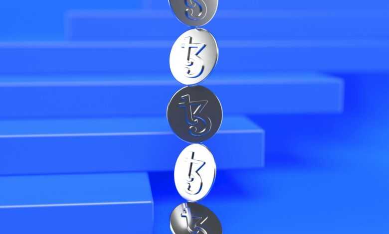 a group of three metal numbers sitting on top of a blue surface