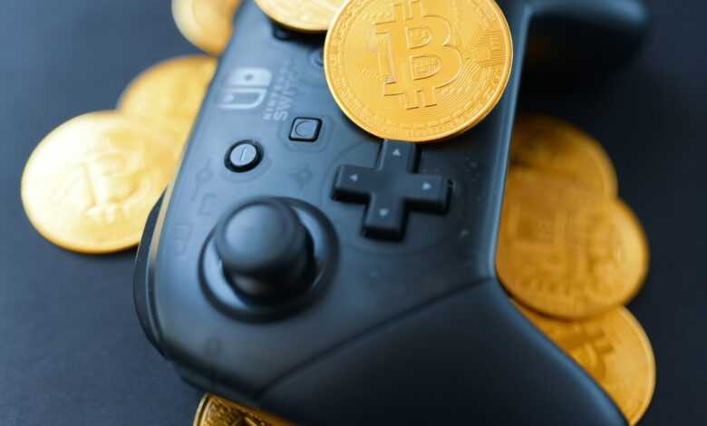 a video game controller surrounded by bitcoins