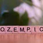 A close up of a scrabble type word on a table